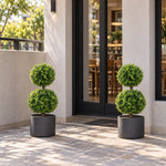 Pair of artificial two ball topiary trees in matching patio planters