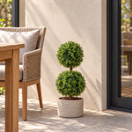 Artificial two ball boxwood topiary in a stone-look outdoor planter