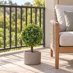 Artificial single ball topiary in a low decorative balcony planter