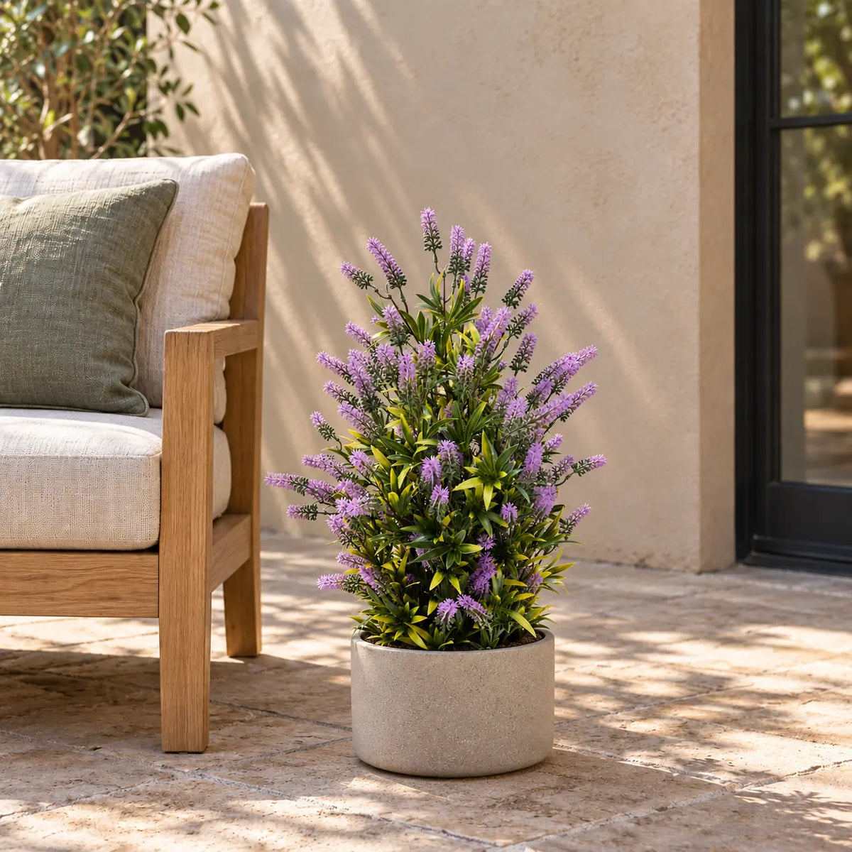 Artificial lavender topiary in a decorative patio planter