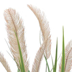 Close-up of beige artificial reed plumes and slender green leaves