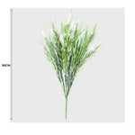 Artificial green plant with white flowers on a gray background