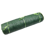 Roll of green netting with green ties on a white background