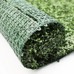 Roll of artificial grass on a white background