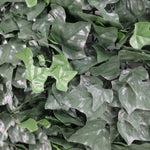 Close-up of artificial green leaves with a blurred background