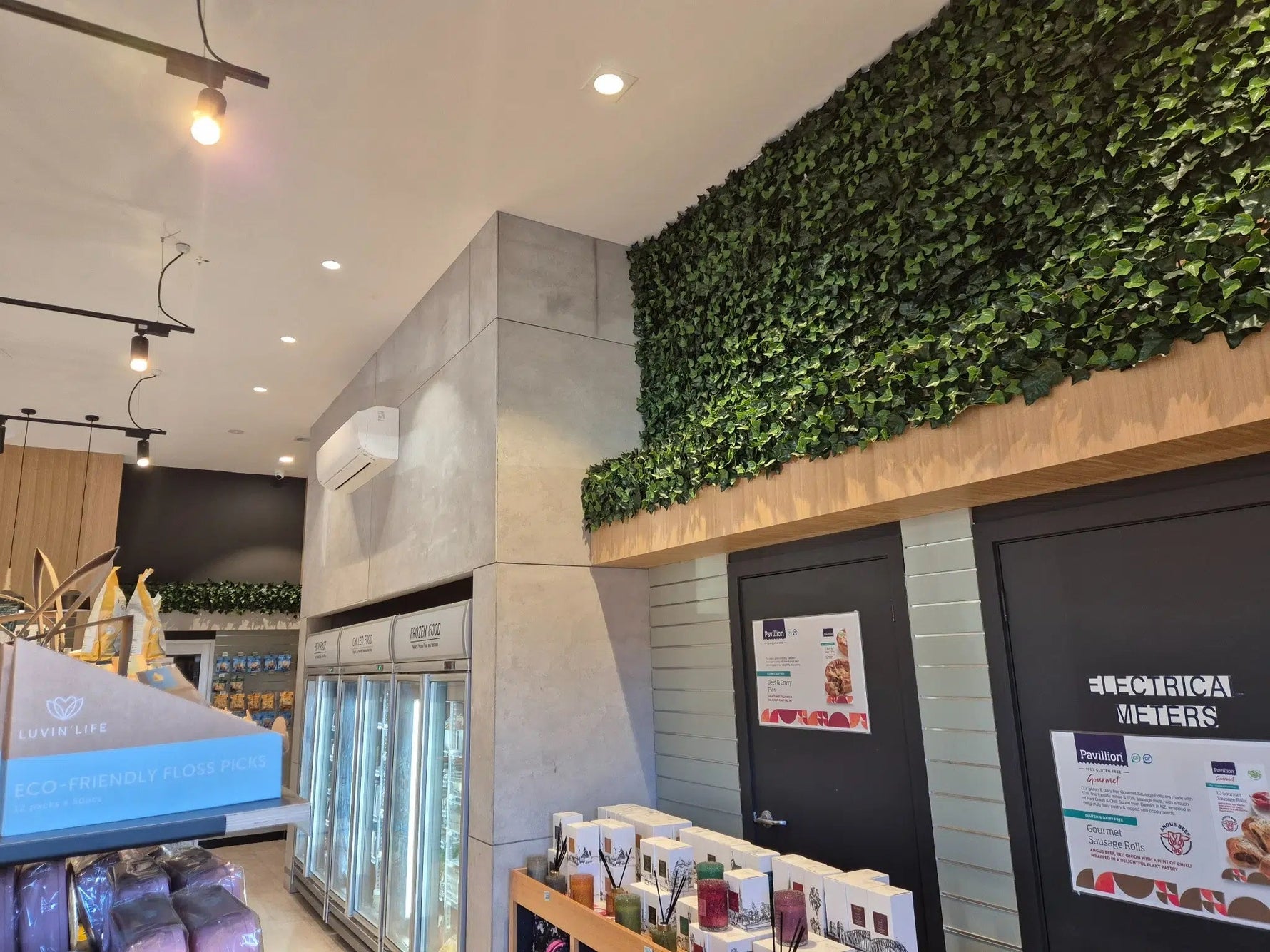 Futuristic interior design with green wall and modern decor elements.
