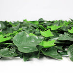 Artificial green leaves on a white background