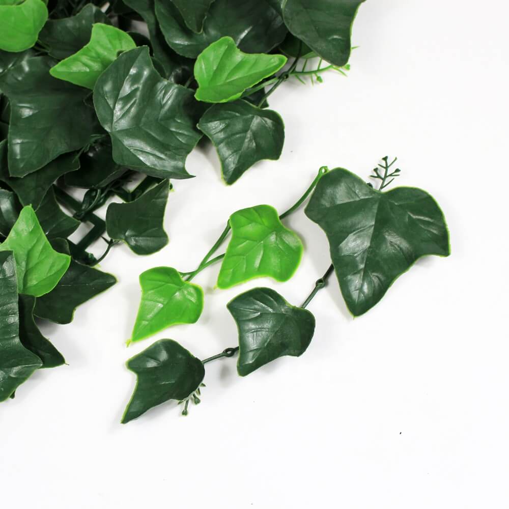 Artificial green leaves on a white background
