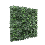 Artificial green leaf panel on a white background