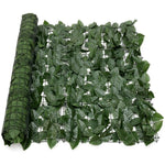 Roll of green artificial leaf mesh on a white background