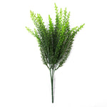 Artificial green bush on a white background