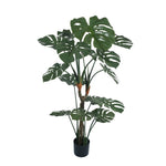 Potted artificial monstera plant on a white background