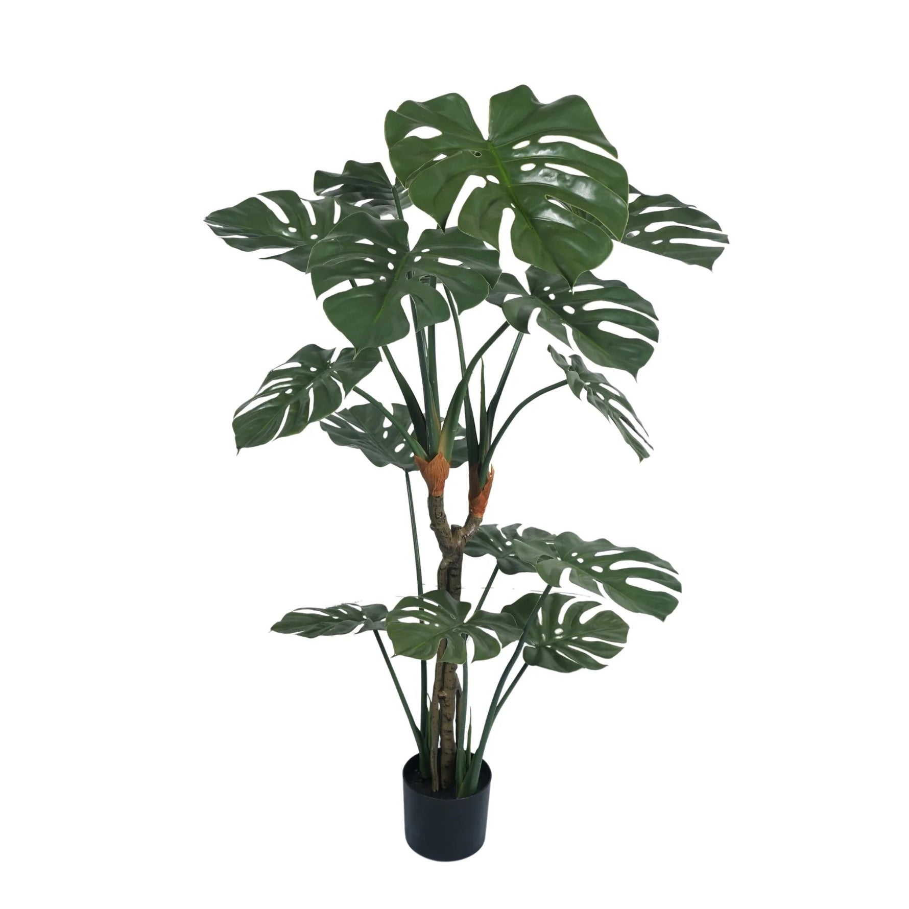 Potted artificial monstera plant on a white background