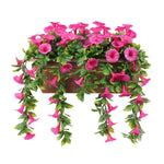 Artificial hanging flower basket with pink flowers and green leaves on a white background
