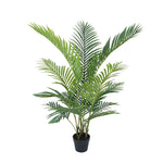 Potted artificial palm plant on a white background
