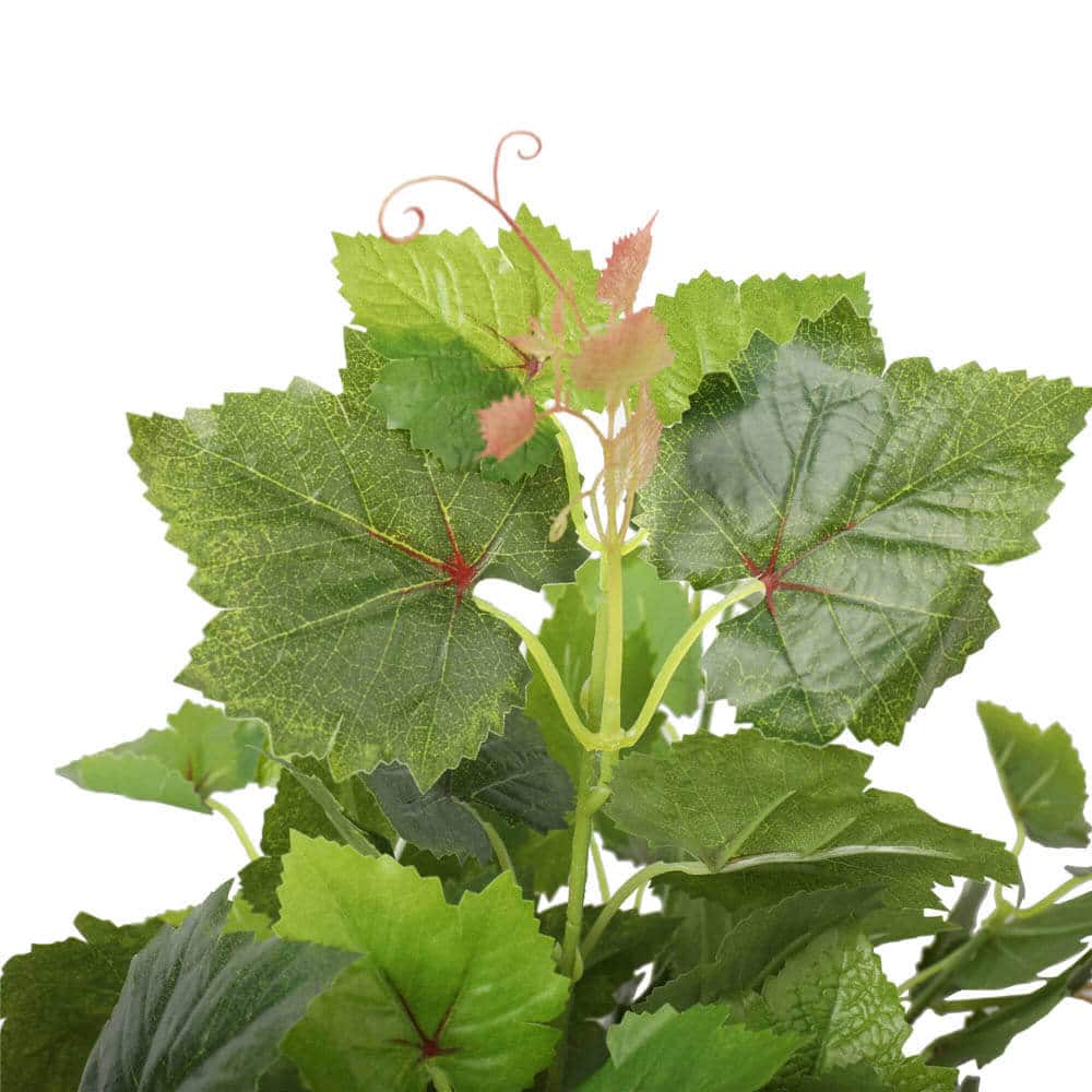 Artificial green leaves with pink flowers on a white background