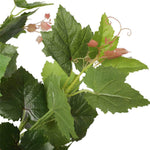 Artificial green leaves with pink buds on a white background