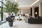 Tall artificial eucalyptus tree styled in commercial lobby