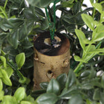 Artificial plant with a wooden base and green leaves