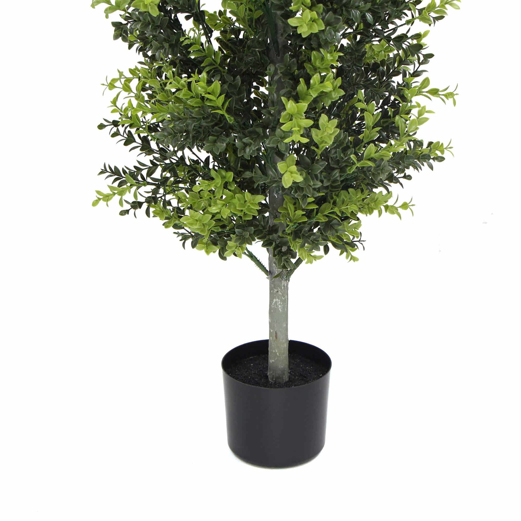 Potted artificial tree with green leaves on a white background