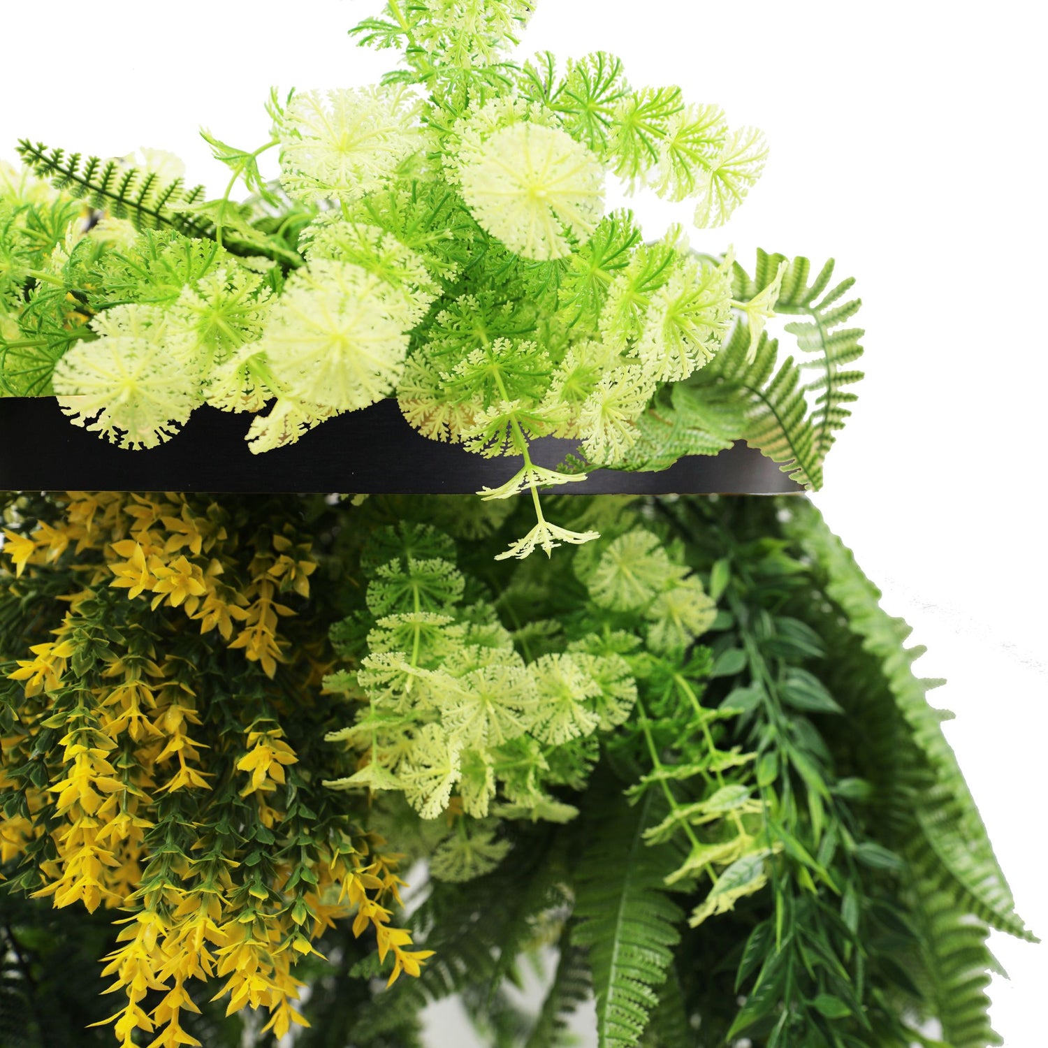Close-up of green and yellow artificial plants on a white background