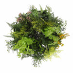 Artificial greenery wreath with various plants on a white background