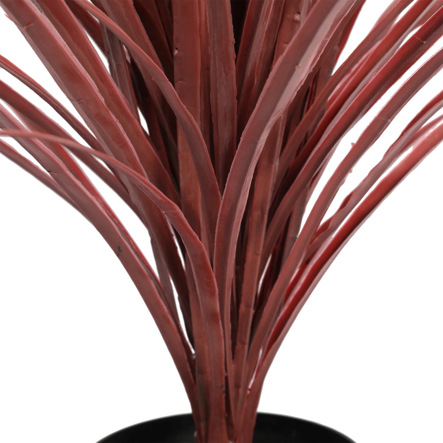 Artificial plant with red-brown stems on a white background