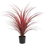 Artificial red grass plant in a black pot on a white background