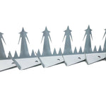 Row of metal bird spikes on a white background