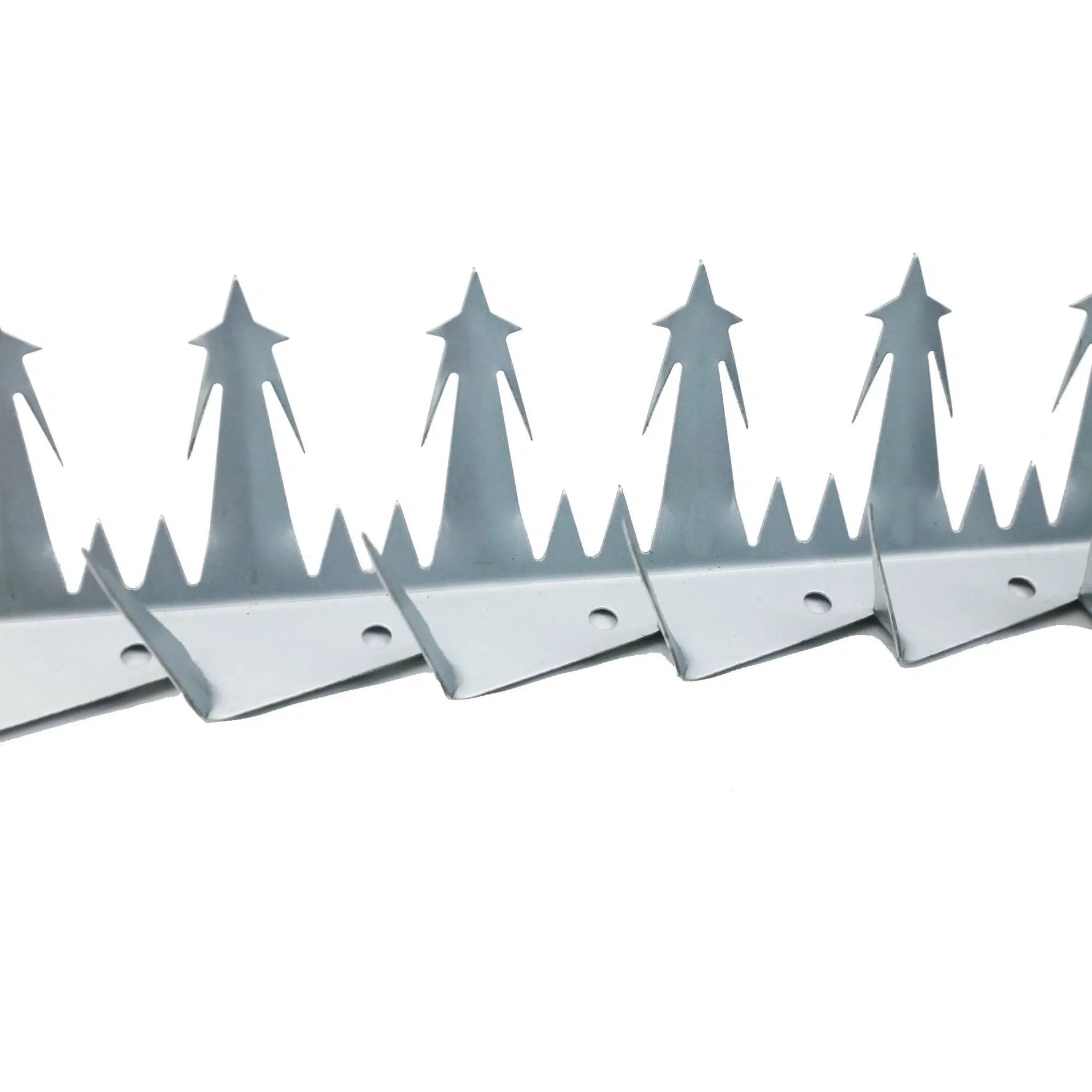 Row of metal bird spikes on a white background