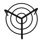 Black metal trivet on a white background