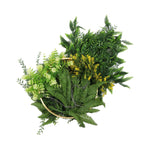 Artificial greenery arrangement with ferns and other plants in a decorative basket on a white background