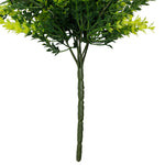 Artificial green plant with a white background