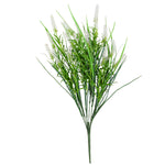 Artificial green plant with white flowers on a white background