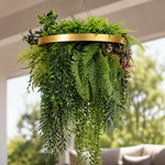 Hanging fern plant with a gold rim in an outdoor setting