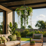Outdoor patio with a couch, chairs, and hanging floral decorations on a sunny day.