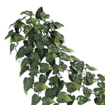 Artificial green leafy plant on a white background