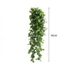 Artificial green leaf garland with measurement on a white background