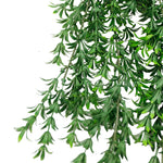 Artificial green leaves on a white background