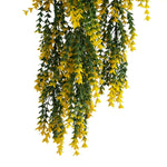 Artificial hanging plant with yellow flowers on a white background