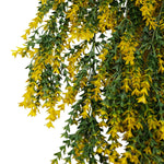 Artificial hanging plant with yellow flowers and green leaves on a white background