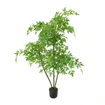 Potted artificial plant with green leaves on a white background