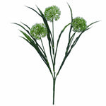 Artificial green plant with three branches on a white background