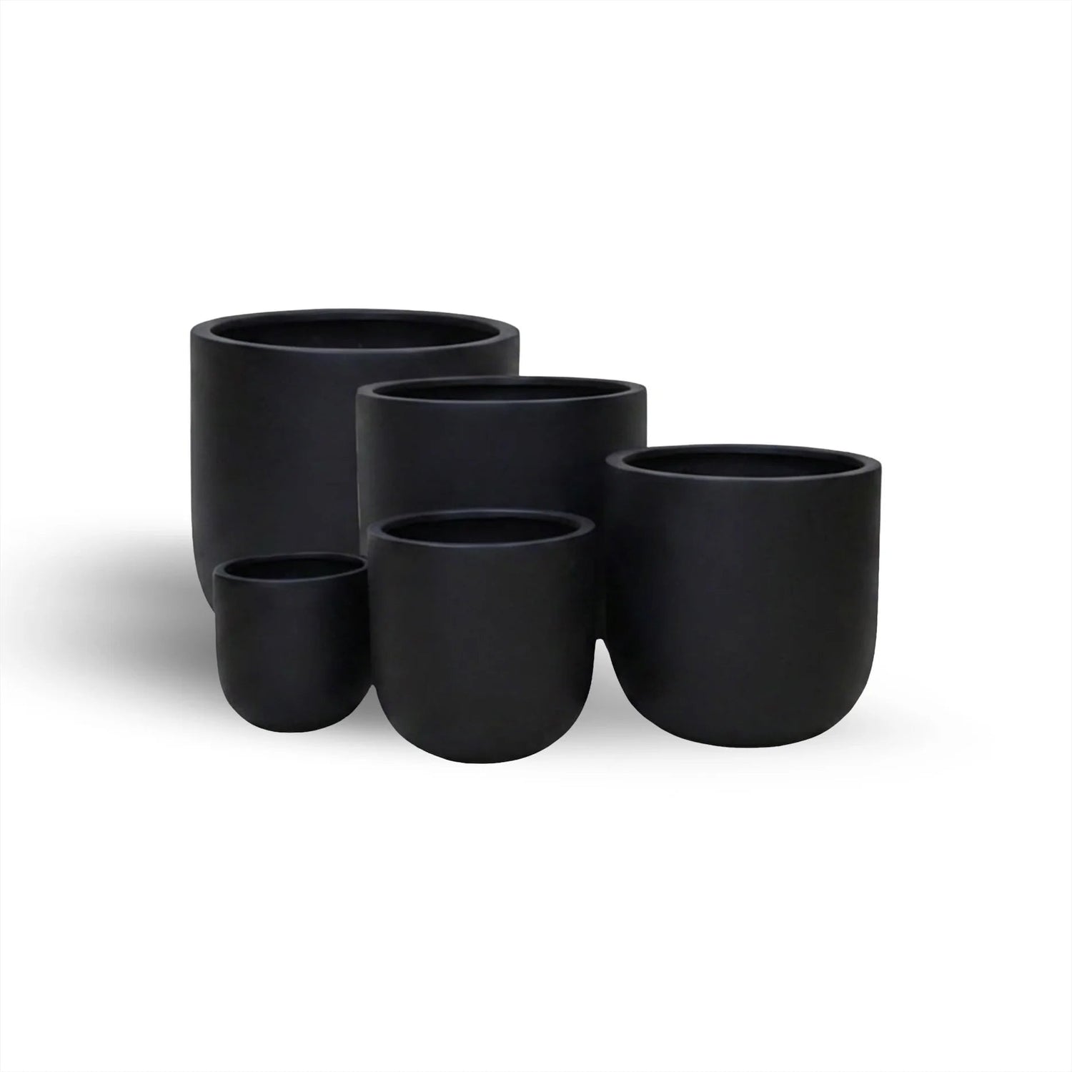 Set of five black ceramic planters of different sizes on a white background