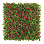 Artificial green wall panel with red flowers on a white background