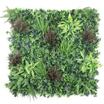 Artificial green wall panel with various types of greenery on a white background