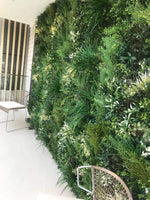 Artificial green wall with plants in an outdoor setting