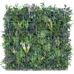 Green wall made of plants behind a wire frame on a white background