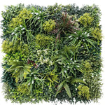 Artificial green wall with various types of plants on a white background