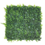 Artificial green wall panel with grid structure on a white background